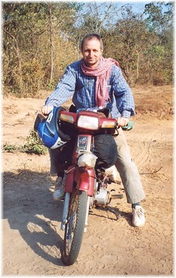 Andy Brouwer posing on Sokhom's moto!